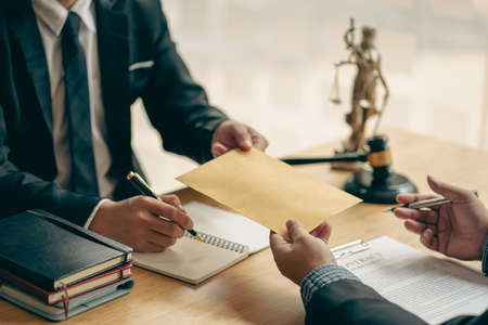 business law concept lawyer business Consultation between male lawyers and business clients The company provides tax and legal services and discusses contract documents between malの写真素材