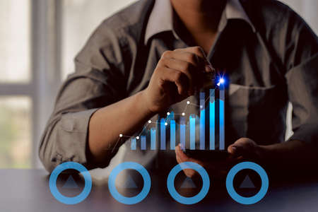 business process and strategy concepts on tech virtual screen background Innovations and solutions for financial growth with graph icons.の写真素材