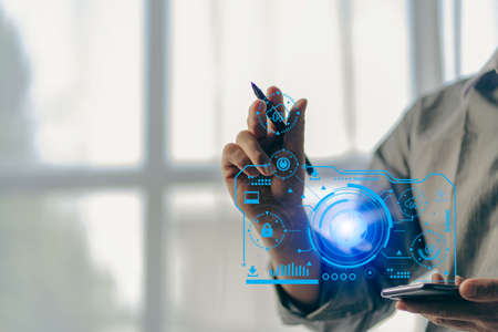 Mobile app. Internet of things. IOT concept. Close-up of hipster hands using smartphone. businessman with phone information symbol and network circuitの写真素材