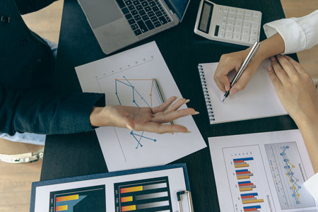 Asia business advisors meeting to analyze and discuss financial reports situation in the meeting...