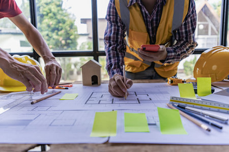 engineer working in office draw a construction project An architect's hand-drawn print engineer...