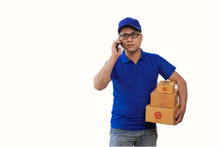 Asian man in blue t-shirt wearing glasses holding yellow box white background delivery concept