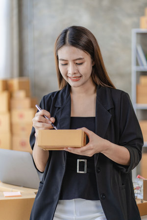 Starting small businesses SME owners female entrepreneurs Write the address on receipt box and check...
