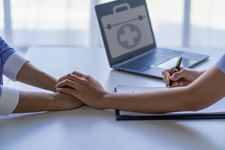 Health care concepts of a professional psychologist doctor. Counseling in psychotherapy or consulting on diagnosis
A female doctor sits at a table and talks to the patient.の写真素材