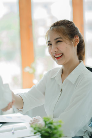 Asian woman working in accounting with laptop
That calculates household finances with a calculator on the expense planning desk. debt and loan business and finance concept tax verの写真素材