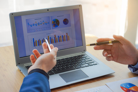 business people meeting to analyze and discuss and brainstorm data charts financial reports...