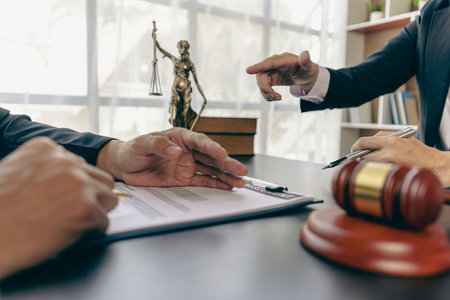 Businessmen and lawyers discuss contract documents. Treaty Law. business contract and legal documents and study information about common court cases with the scales of justice andの写真素材