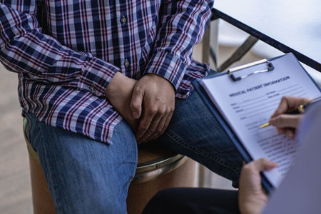 Female doctor and male testicular cancer patient discuss test results. Concerned about prostate cancer is seeking advice from a counselor who specializes in prostate cancer.の写真素材