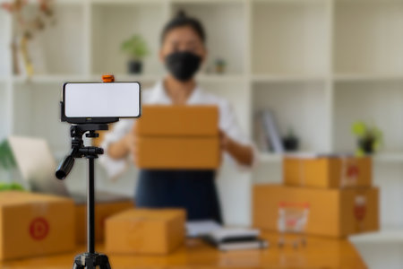 Small Business SME, young asian woman taking new orders from customers, business owner working at...