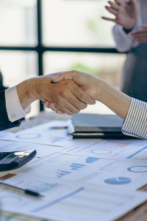 Businessmen shaking hands during a meeting to sign an agreement and a successful business partnership for both companies, new colleague team greeting conceptの写真素材