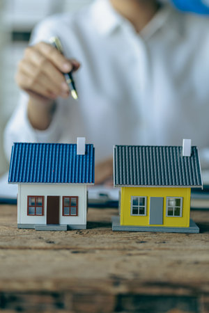 Home Agent recommends interest rates and installment payments for real estate sales. real estate concept Buy an apartment or rent a house vertical imageの写真素材