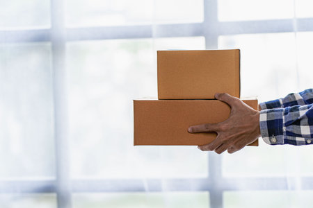 <p>Startup or Small Business Entrepreneur prepare to deliver with parcel box note delivery address...