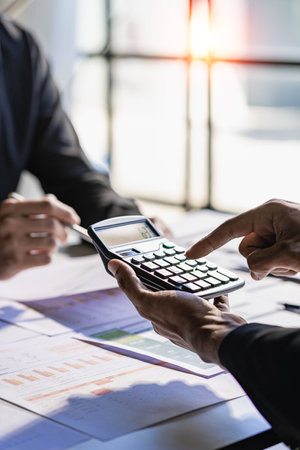 Consulting between bookkeepers and business lawyers on assets, balance sheets, stock market statistics. and annual tax law Protect your business from bribery in the office. verticaの写真素材