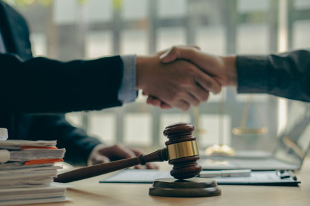 Agreement, Law, Advice and Justice
 Businessman shaking hands to sign agreement with lawyer, partner or his attorney on contract agreement. office lawの写真素材