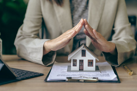 Home insurance and family health concept Insurance agent presenting hand drawn protection symbol property protection, home insurance conceptの写真素材