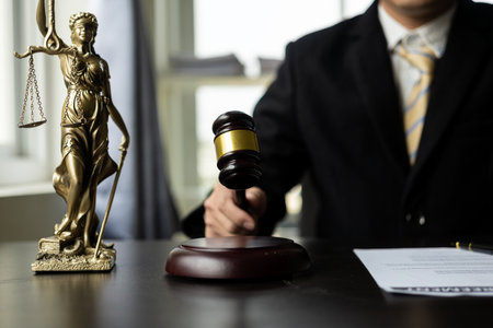 Lawyer working in the office law and justice concept male judge Businessman's consultant legal service Advising on various contracts to plan a case in court.の写真素材