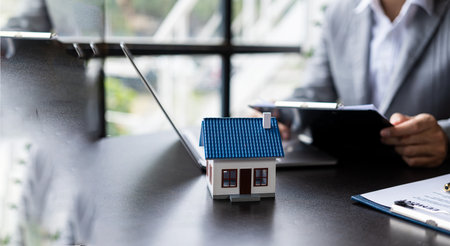Real estate offices for home insurance, investment advisers, insurance and property businessmen offering model homes.の写真素材