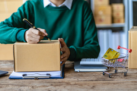 Small Business Startup SME Owner Asian Woman Checking Online Orders Sell â€‹â€‹goods, work...