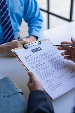 Send resumes to employers to review job applications. The concept presents the company's ability to agree on job positions. Executive reading resume during job interview and busineの写真素材