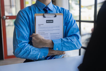 Send resumes to employers to review job applications. The concept presents the company's ability to agree on job positions. Executive reading resume during job interview and busineの写真素材