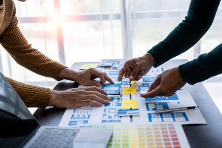 Brainstorm mobile app interface layout design ideas on graphic designer table.ux graphic designer creative sketch planning Mobile web prototype development process vertical imageの写真素材