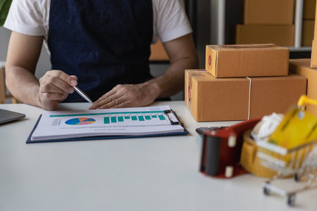 Small business entrepreneurs, take note of shipping addresses from customers, manage orders in online stores, sell online on the internet, SMEs, e-commerce start-ups.の写真素材