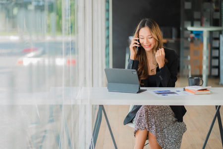 Businesswoman working at office with laptop computer on table Asian female accountant or banker doing calculations The concept of finance and financial economy in the officeの写真素材