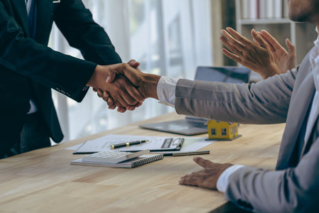 hand in hand close up Businessman and his colleague holding hands in finance, banking and business...