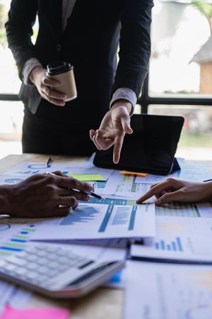 Businessman holding pen, calculator, advisor, investment team stock market analysis Check account documents Analyze business structures and exchange information. human resource recの写真素材