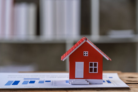 Home insurance concept, laptop mockup on table, real estate loan contract validated, real estate loan.の写真素材