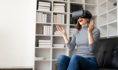 Surprised young latin woman in VR headset touching the air. Smiling caucasian woman wearing vr...
