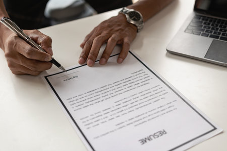 Signing a contract, filling out a personal resume form to prepare for applying for a job in a field that has graduated as a human resource of the companyの写真素材