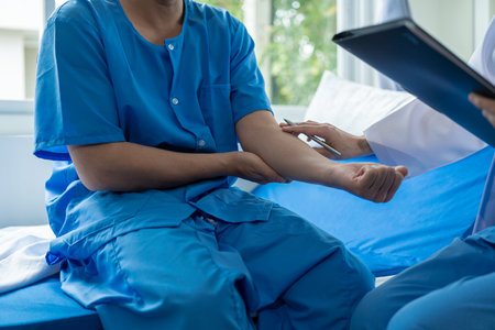 Doctor talking to patient and filling patient history. Examination, treatment. Medical and health concept. Men's disease prevention, health, medical services, consultation,の写真素材