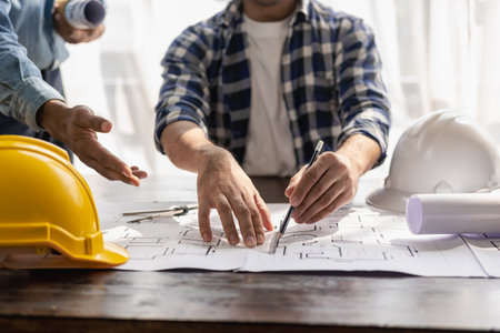 house design architect inspect the house customer-specified projects and according to the model before delivery Engineer in office with blueprints, on-site inspection for architectの写真素材