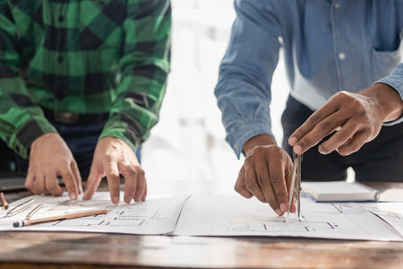 construction site engineer two businessmen Engineering objects in the workplace with engineers and...
