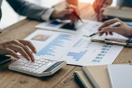Meeting in a business presentation or seminar Group of business people working with documents on...