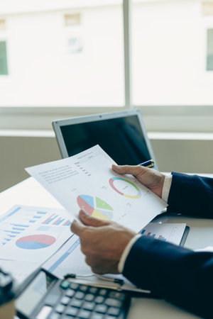 Finance and calculations on the table about expenses at the office Accountant or banker doing...