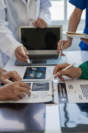 Meeting Asian medical team to find solutions for surgery and treatment, healthy concept, hospital, doctor, diagnosis and testing, research data. vertical pictureの写真素材