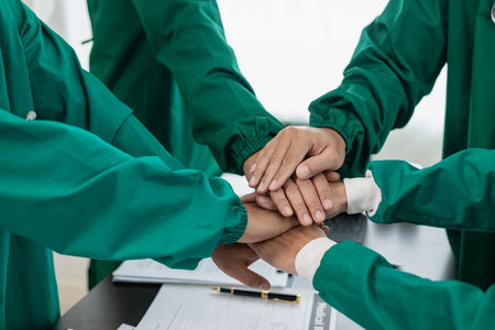 Surgeons join together after work to help patients in hospital operating room, emergency, surgery,...