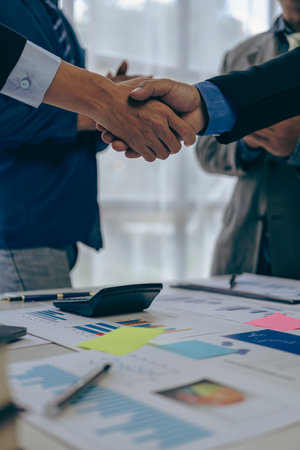 Handshaking, meeting and business people in partnership cooperation and working on agreements in the workplace Thank you teamwork, financial business concept Close-up picturesの写真素材