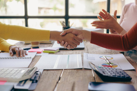 Handshaking, meeting and business people in partnership cooperation and working on agreements in the workplace Thank you teamwork, financial business concept Close-up picturesの写真素材