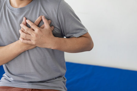 Healthcare concept, A man has severe heart pain and chest pain suffocating.Portrait of man placing...