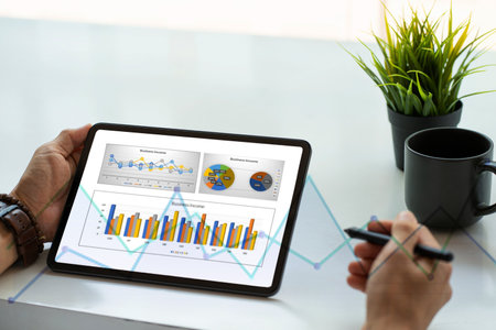 Business accounting concept Businessman uses calculator with laptop computer Budget and borrowed...