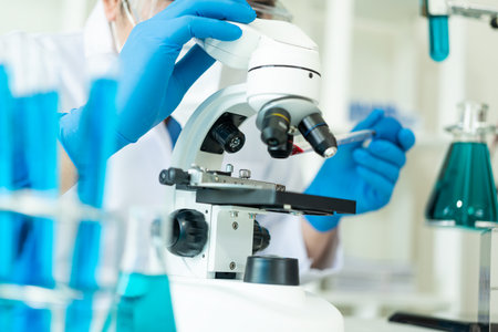 Dedicated scientists conduct chemical experiments in medical laboratories in test tubes to develop drugs, vaccines or antibiotics. Close-up picturesの写真素材