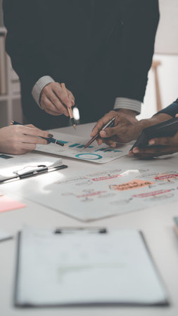 Teamwork and tablets for statistics, financial reports and planning of income, profit or sales of professional consultants or clients with data analysis. Close-up image, vertical.の写真素材