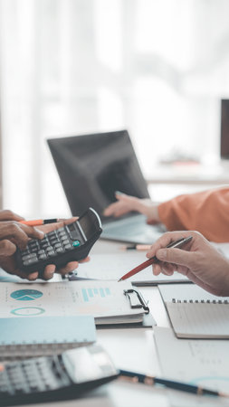 Teamwork and tablets for statistics, financial reports and planning of income, profit or sales of professional consultants or clients with data analysis. Close-up image, vertical.の写真素材