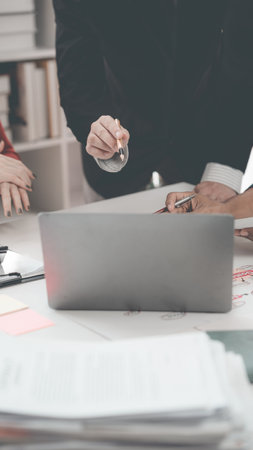 Teamwork and tablets for statistics, financial reports and planning of income, profit or sales of professional consultants or clients with data analysis. Close-up image, vertical.の写真素材