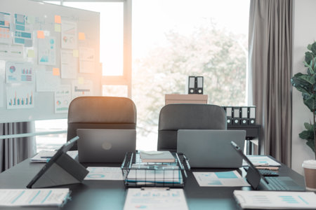 Businessmen discuss charts and graphs showing successful teamwork. Close-up of a team of Business Colleagues analyzing financial data at a table in the office.の写真素材