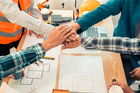 Cooperation with engineers and construction workers Architects and engineers cooperation concept after completing an agreement on a successful collaborative village constructionの写真素材