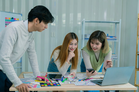 Application development UI UX web designer team is working together to develop a mobile responsive...
